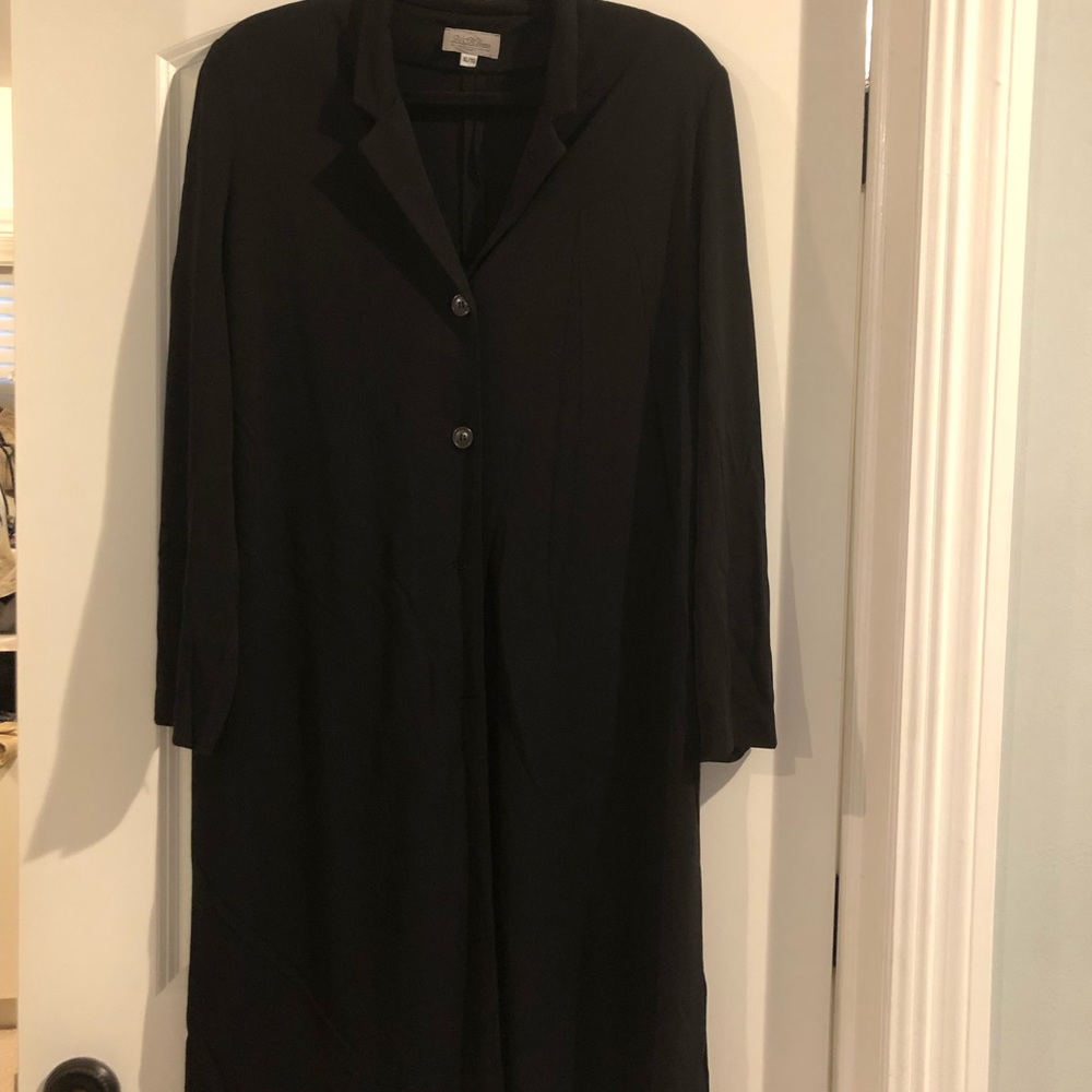 Two piece black women’s suit.